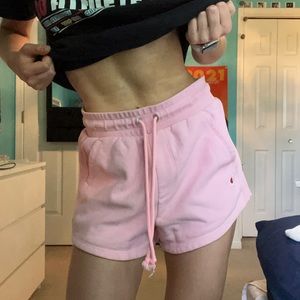 Light pink champion sweat shorts.